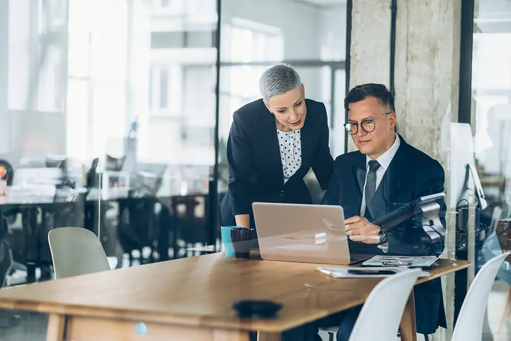 photo of financial professionals using servicenow app engine